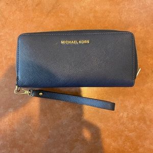Blue leather Michael Kors long wallet/wristlet w/gold writing